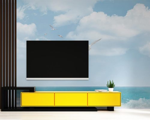 Seagulls Flying in the Blue Sky above Blue Sea Wallpaper Mural A10279500 behind TV
